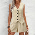 Woman wearing a beige vest and shorts set against a light gray background